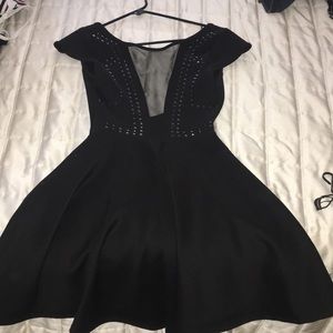 Low black mini dress